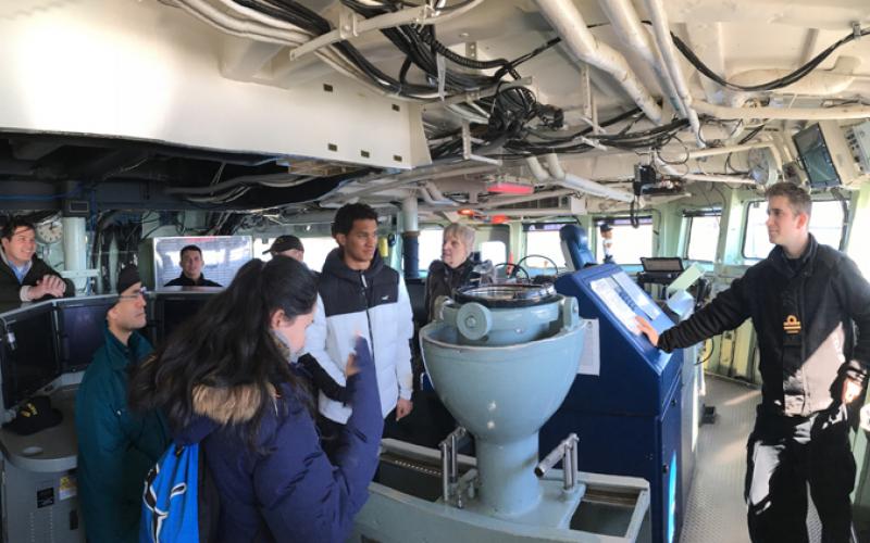 Students on the bridge of a ship